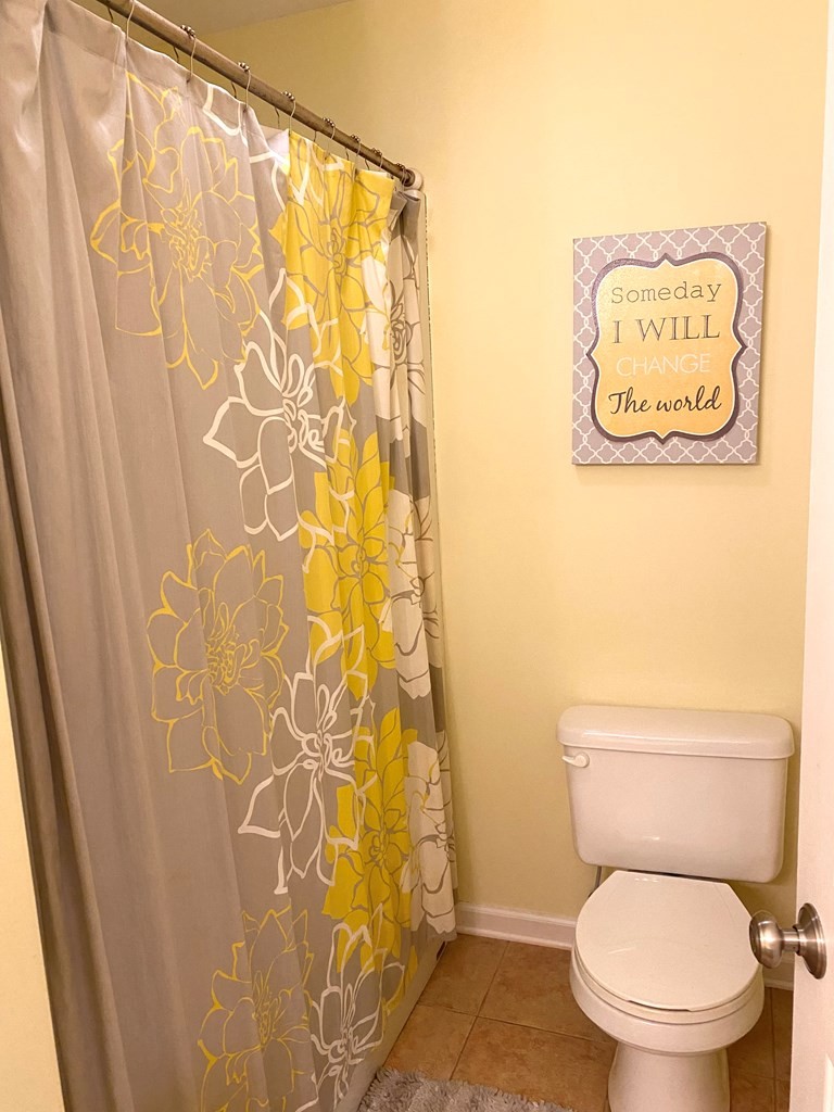 210 Clarks Store Sinking Fork Road Cerulean, KY 42215 - Photo 34 of 45 a white toilet sitting next to a shower curtain