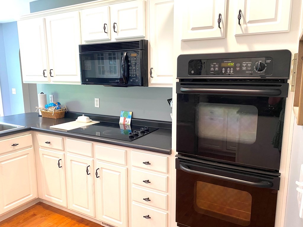 210 Clarks Store Sinking Fork Road Cerulean, KY 42215 - Photo 10 of 45 a kitchen with a stove and a microwave