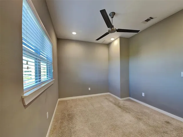 a bathroom with a toilet and a bathtub
