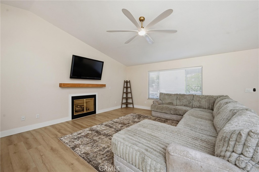 16906 Greenridge Road Hidden Valley Lake, CA 95467 - Photo 2 of 24 a living room with furniture a fireplace and a flat screen tv