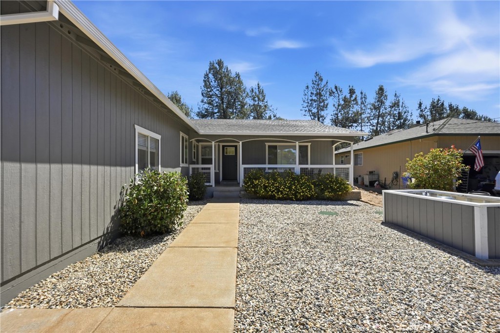 16906 Greenridge Road Hidden Valley Lake, CA 95467 - Photo 21 of 24 a front view of a house with garden