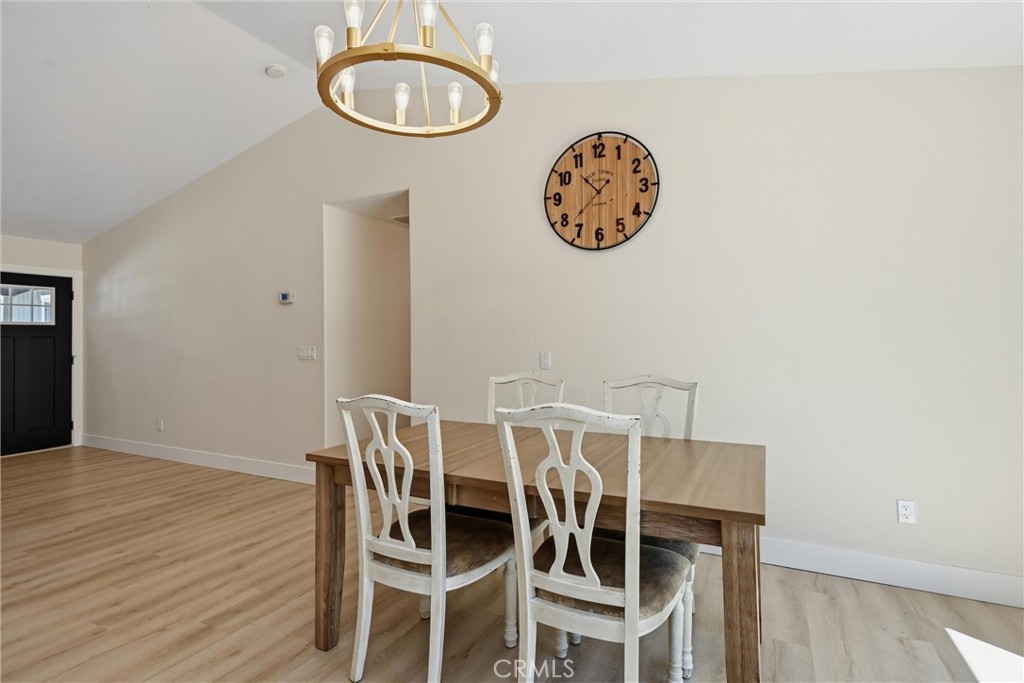 16906 Greenridge Road Hidden Valley Lake, CA 95467 - Photo 6 of 24 a view of a dining room with furniture and wooden floor