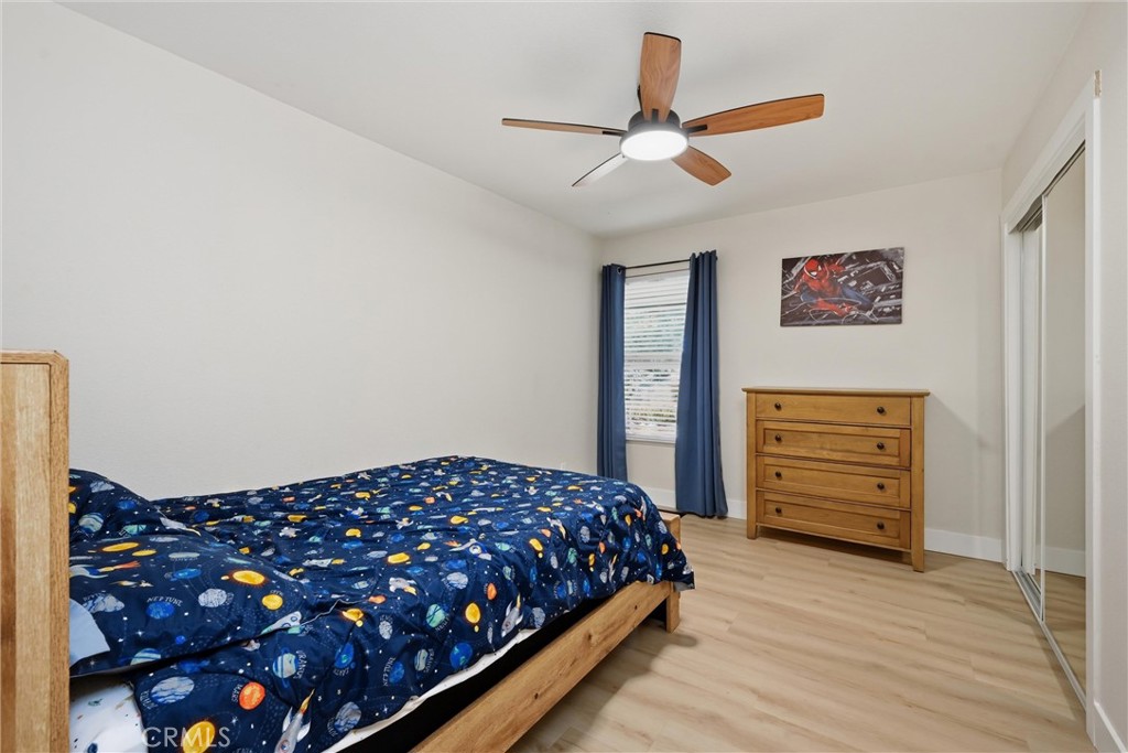16906 Greenridge Road Hidden Valley Lake, CA 95467 - Photo 10 of 24 a bedroom with a bed and a cabinet