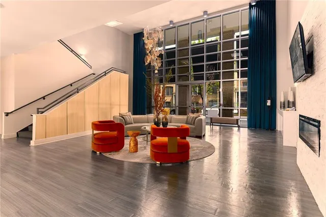 a living room with furniture window and wooden floor