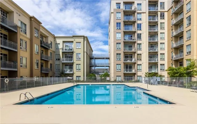 a kitchen with a stove and a large window
