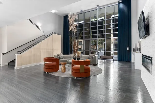 a living room with furniture window and wooden floor