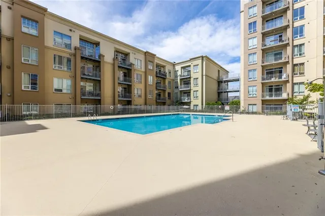 a view of an buildings with a swimming pool