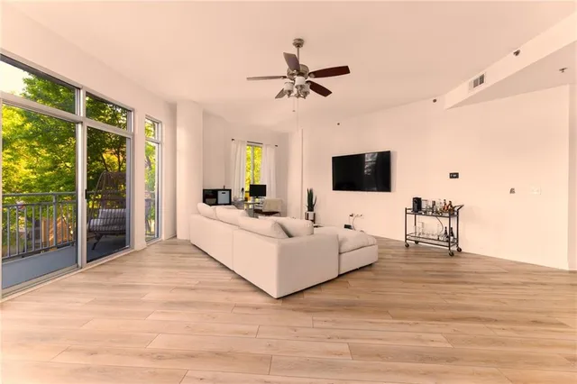 a living room with furniture fireplace and a flat screen tv