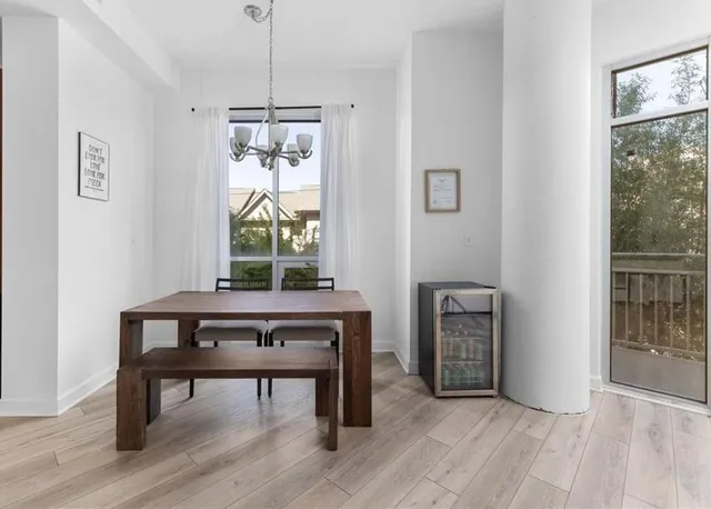 a view of a room with furniture window and wooden floor