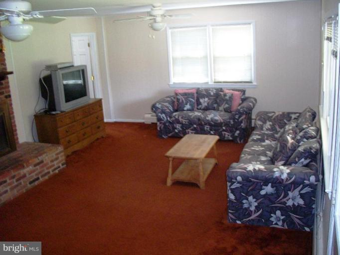 14608 Sturtevant Road Silver Spring, MD 20905 - Photo 17 of 27 a living room with furniture and a window
