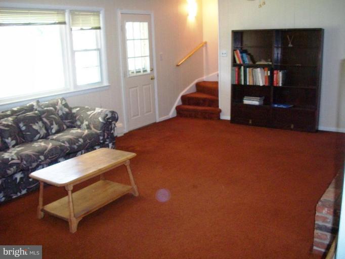 14608 Sturtevant Road Silver Spring, MD 20905 - Photo 19 of 27 a living room with furniture and a window