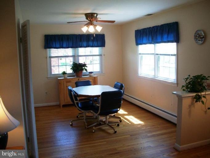 14608 Sturtevant Road Silver Spring, MD 20905 - Photo 4 of 27 a workspace with furniture window and wooden floor