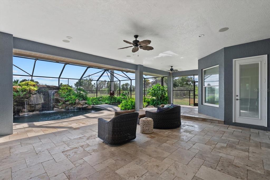 6816 Hawkins Road Sarasota, FL 34241 - Photo 30 of 60 a living room with furniture and a potted plant