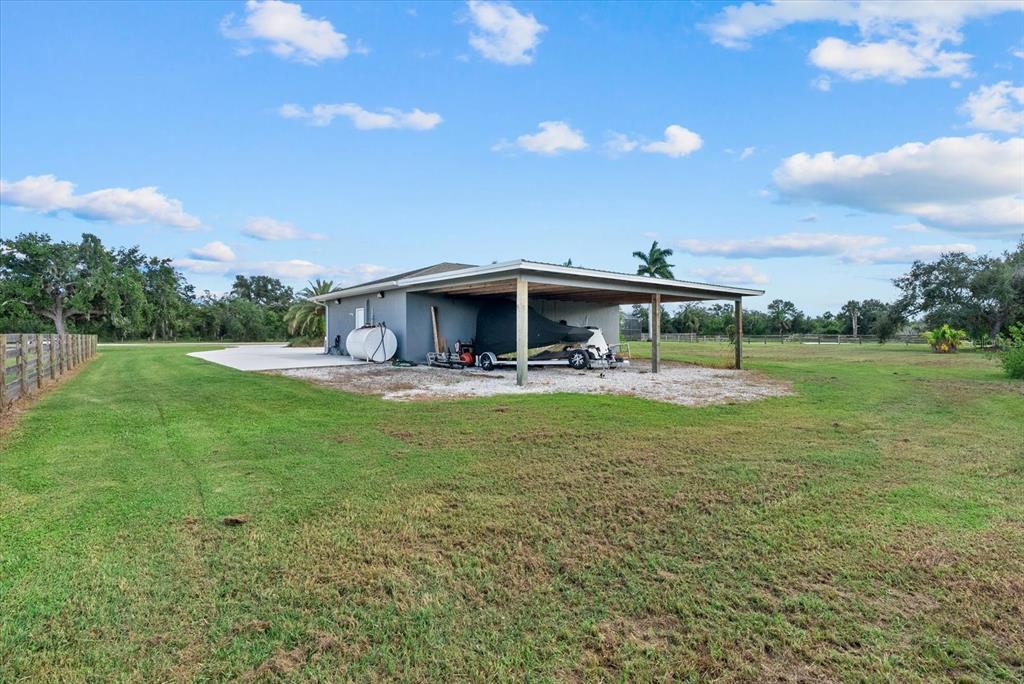 6816 Hawkins Road Sarasota, FL 34241 - Photo 39 of 60 a view of a big house with a big yard