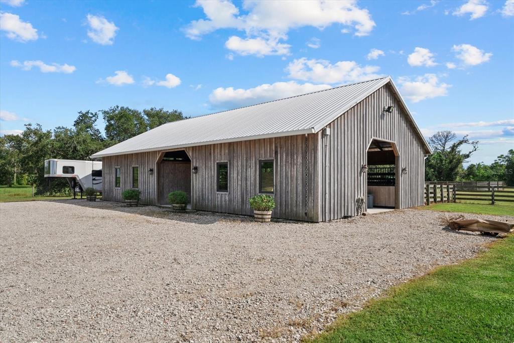 6816 Hawkins Road Sarasota, FL 34241 - Photo 43 of 60 a front view of a house with a yard and garage