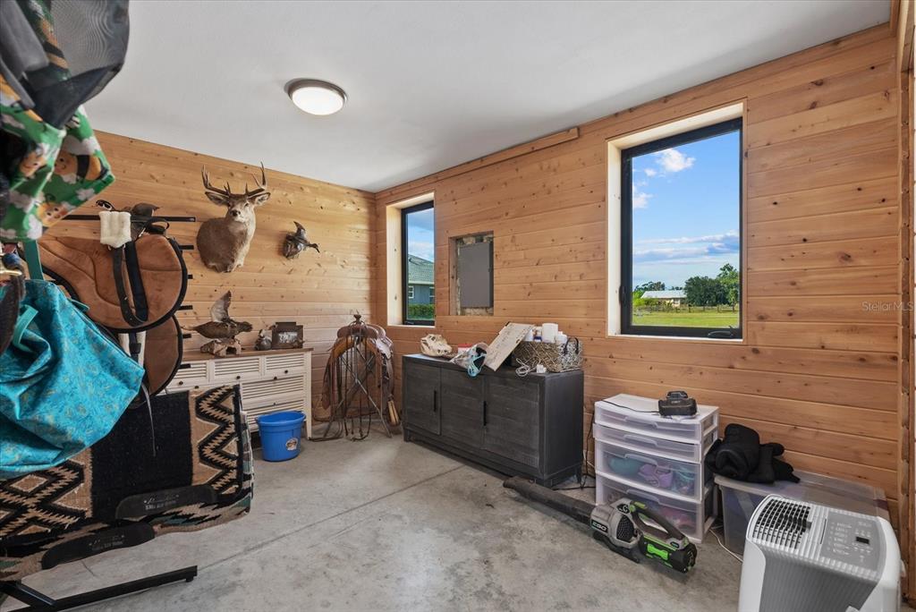 6816 Hawkins Road Sarasota, FL 34241 - Photo 47 of 60 a bedroom with furniture and a window