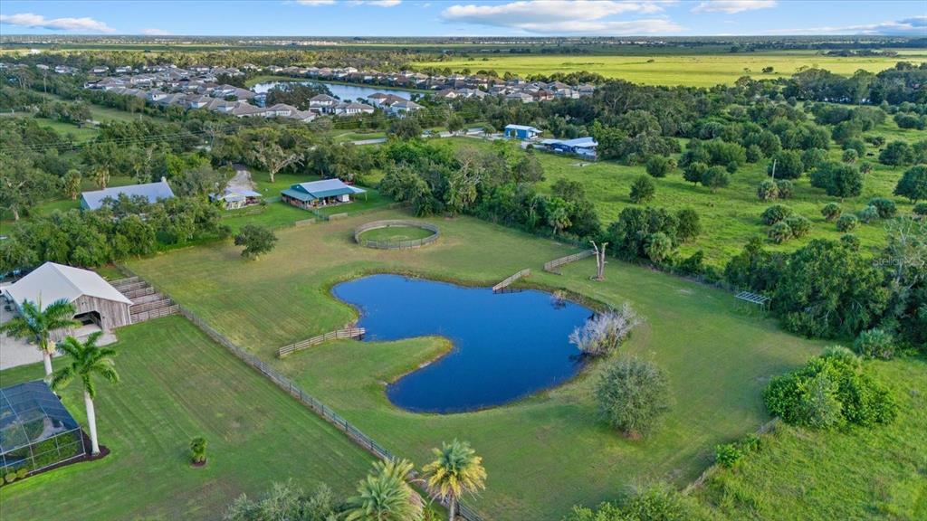 6816 Hawkins Road Sarasota, FL 34241 - Photo 50 of 60 a view of a water pond with green yard