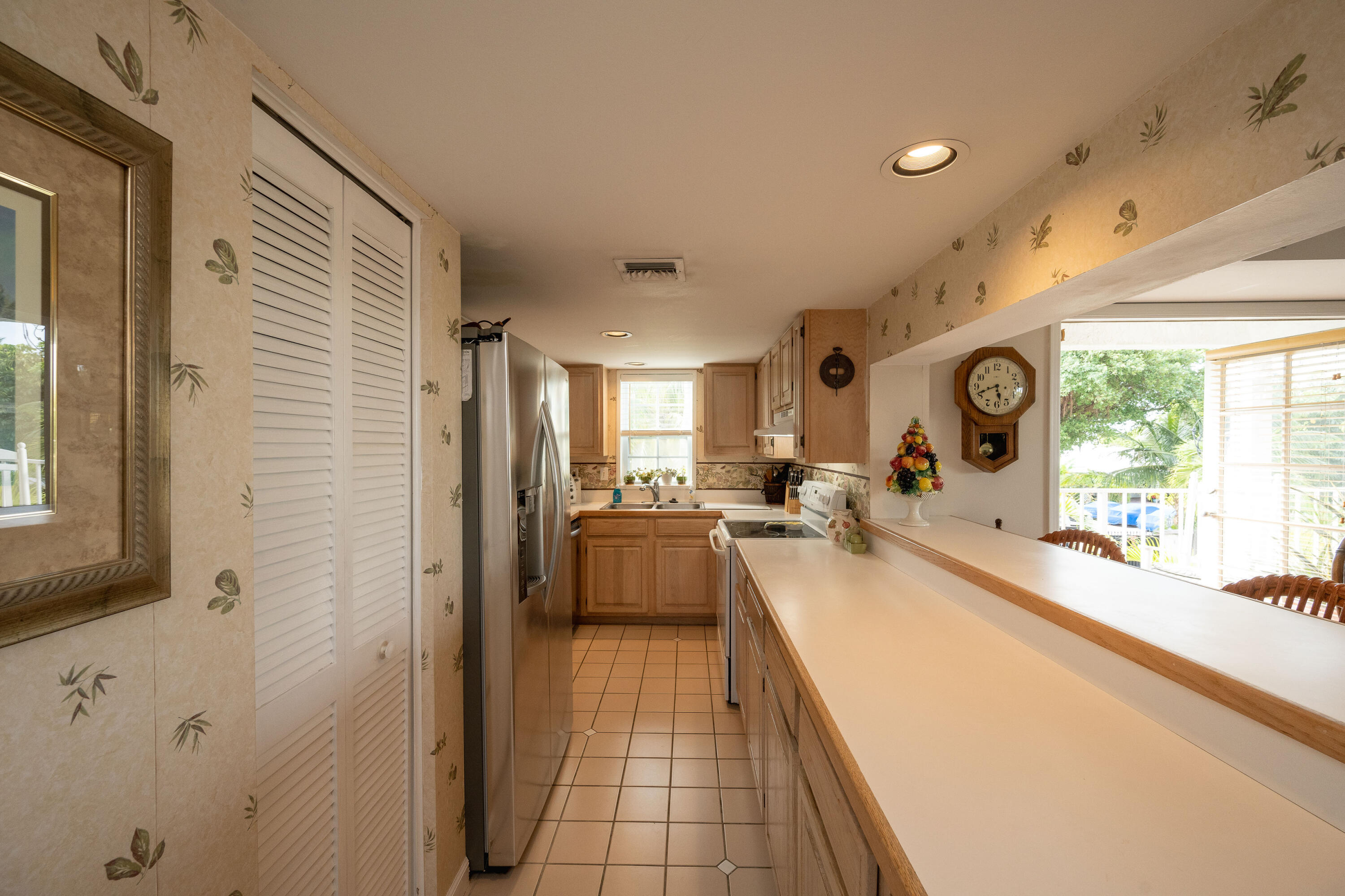 30 Hilton Haven Road, Unit 2A Key West, FL 33040 - Photo 16 of 42 a large white kitchen with a large window