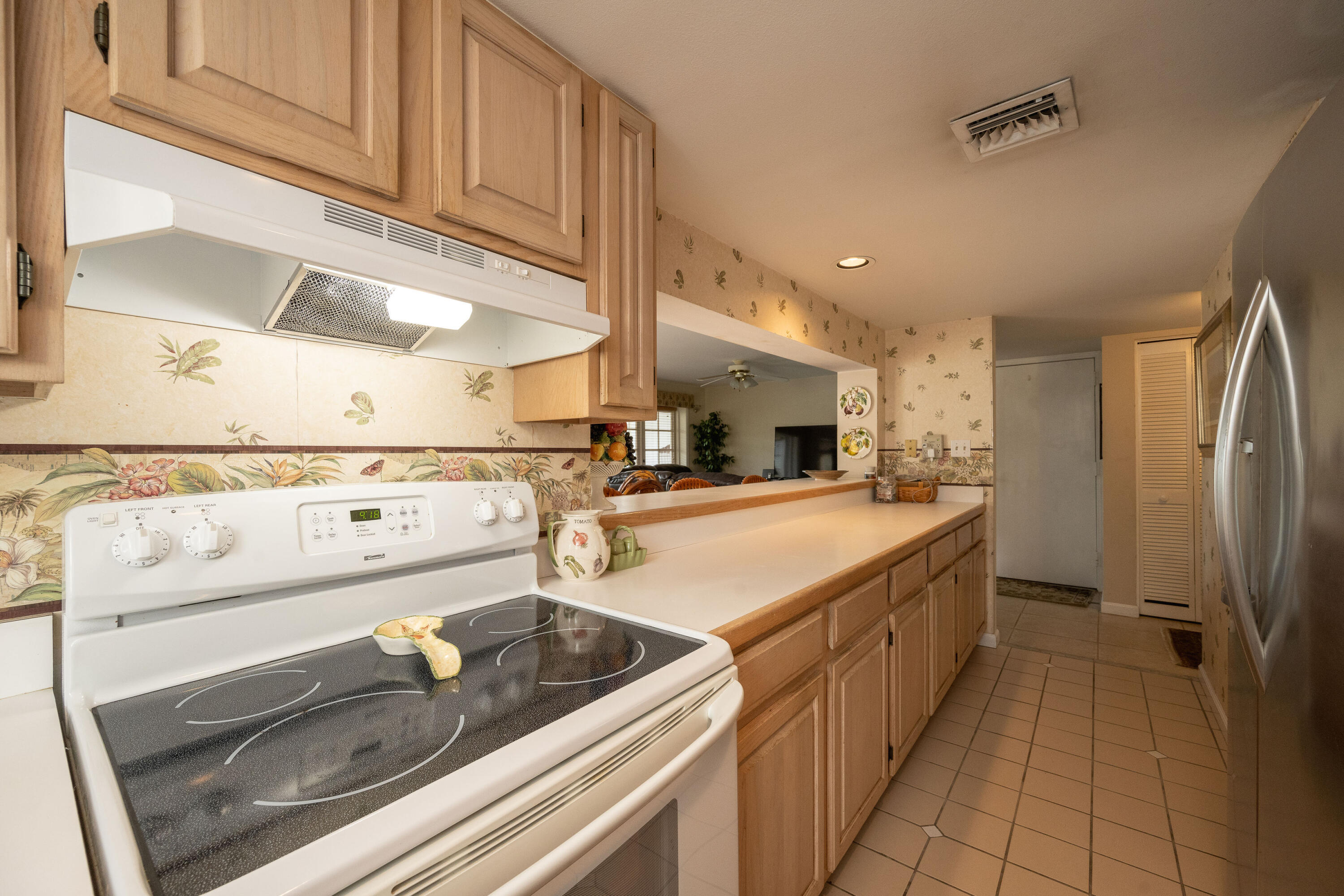30 Hilton Haven Road, Unit 2A Key West, FL 33040 - Photo 18 of 42 a kitchen with stainless steel appliances granite countertop a sink and a stove