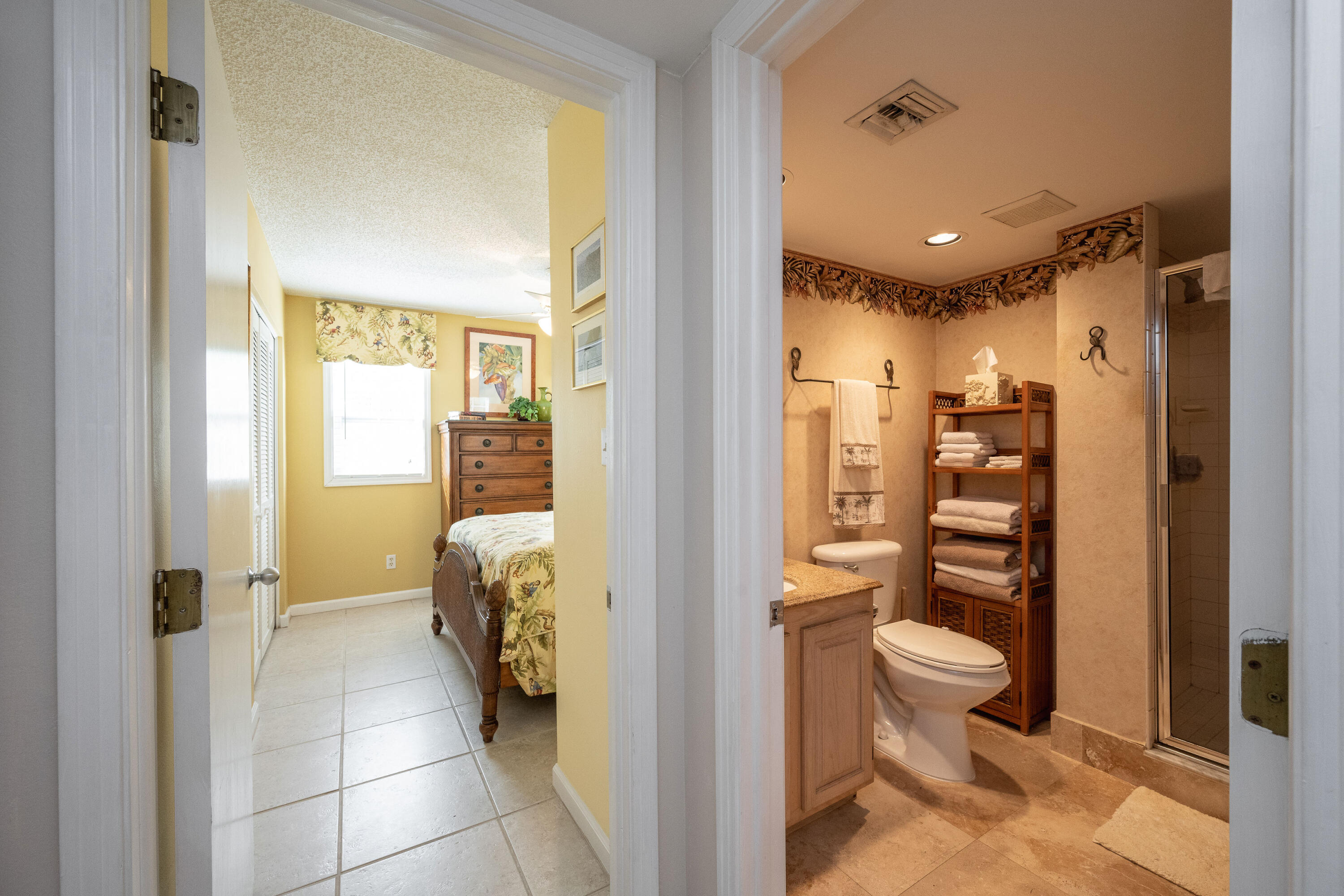 30 Hilton Haven Road, Unit 2A Key West, FL 33040 - Photo 20 of 42 a bathroom with a toilet shower and a mirror