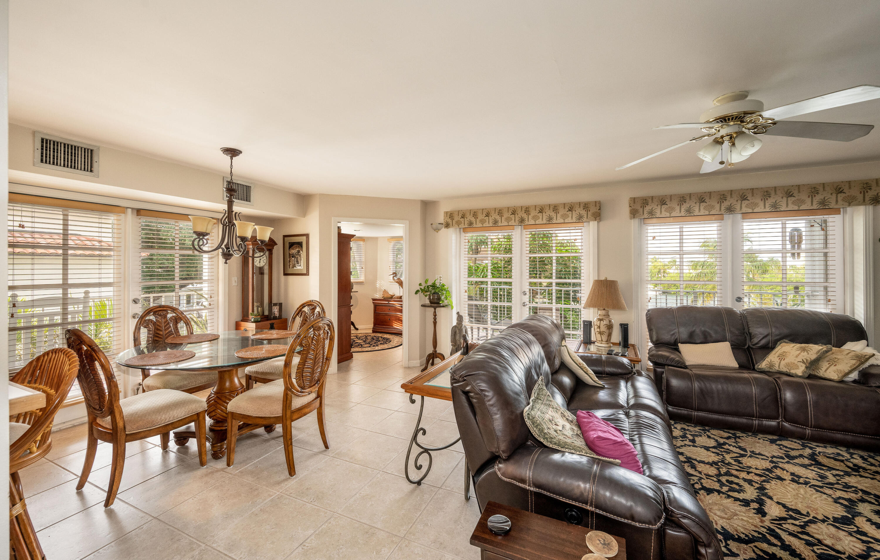 30 Hilton Haven Road, Unit 2A Key West, FL 33040 - Photo 2 of 42 a living room with furniture and a floor to ceiling window