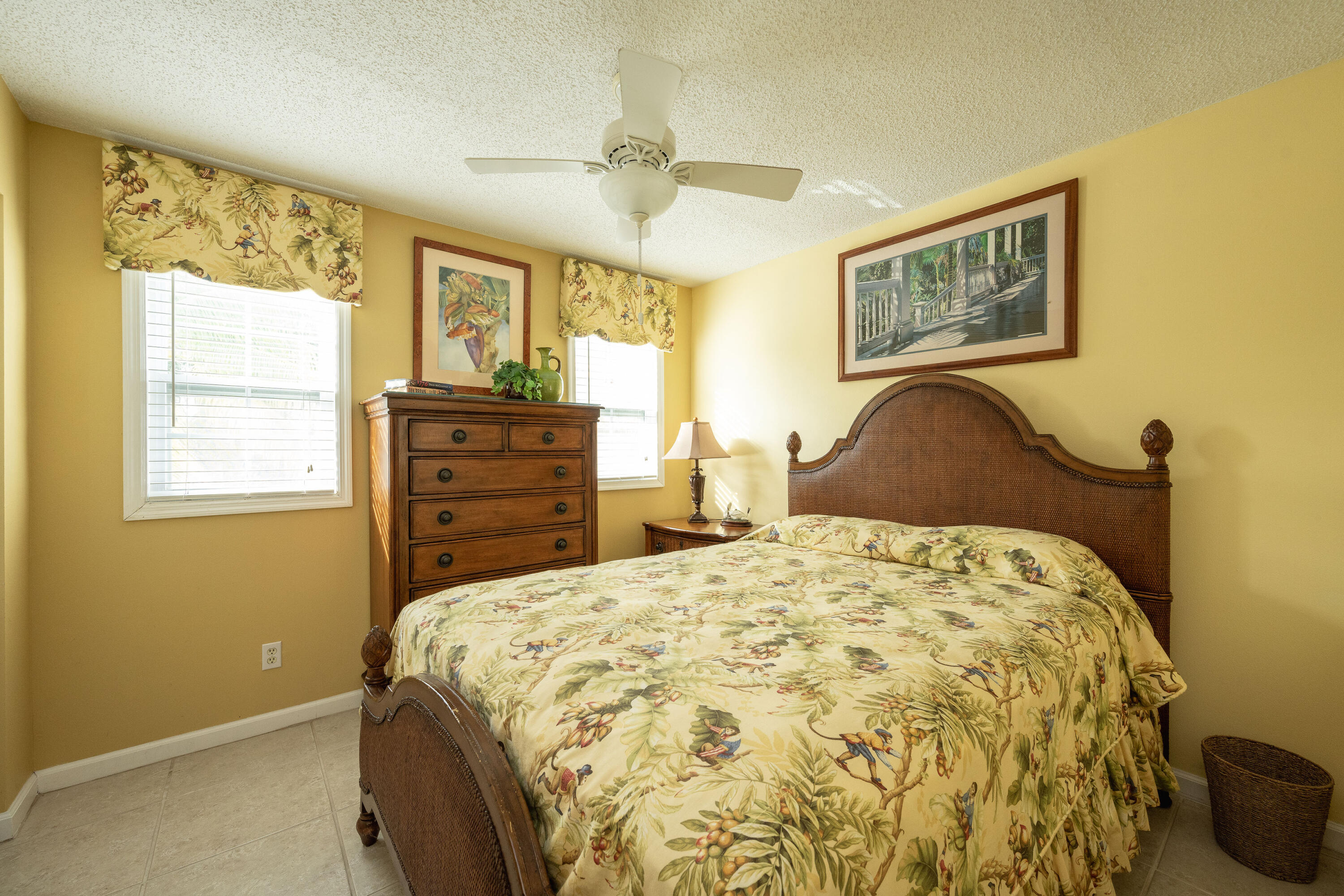 30 Hilton Haven Road, Unit 2A Key West, FL 33040 - Photo 22 of 42 a bedroom with a bed and wooden floor