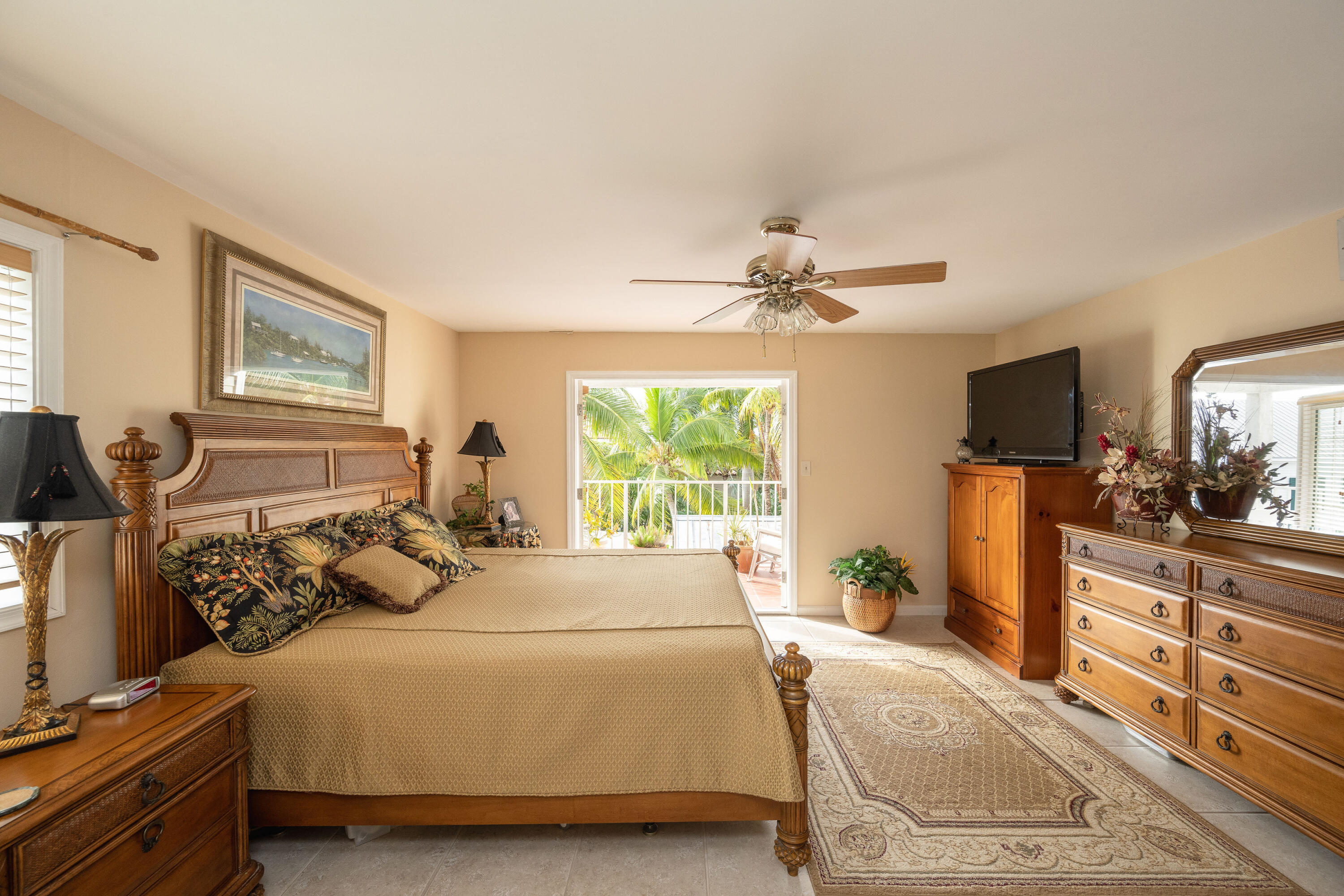 30 Hilton Haven Road, Unit 2A Key West, FL 33040 - Photo 24 of 42 a bed room with a bed and a television