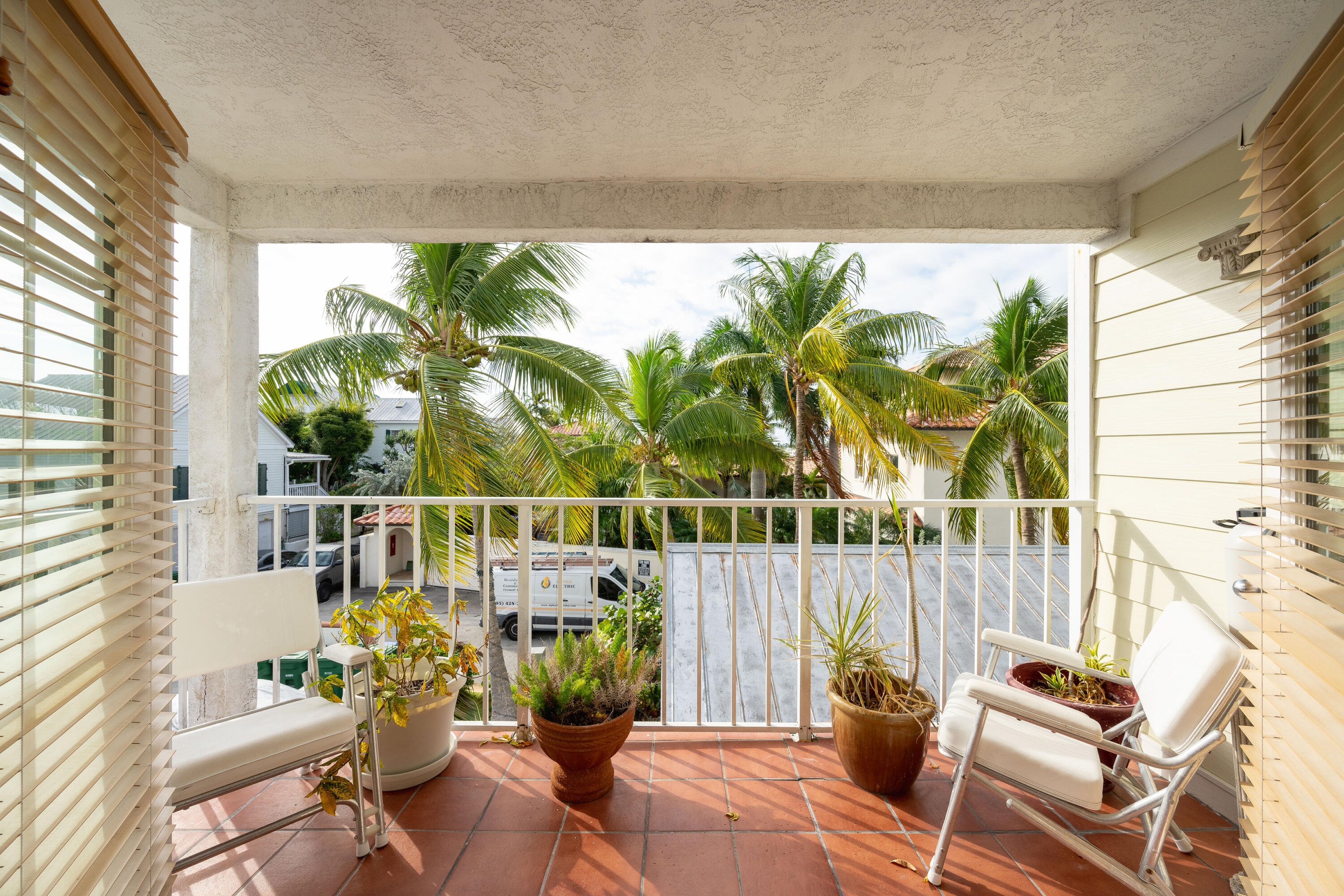 30 Hilton Haven Road, Unit 2A Key West, FL 33040 - Photo 27 of 42 a living room filled with furniture and a large window