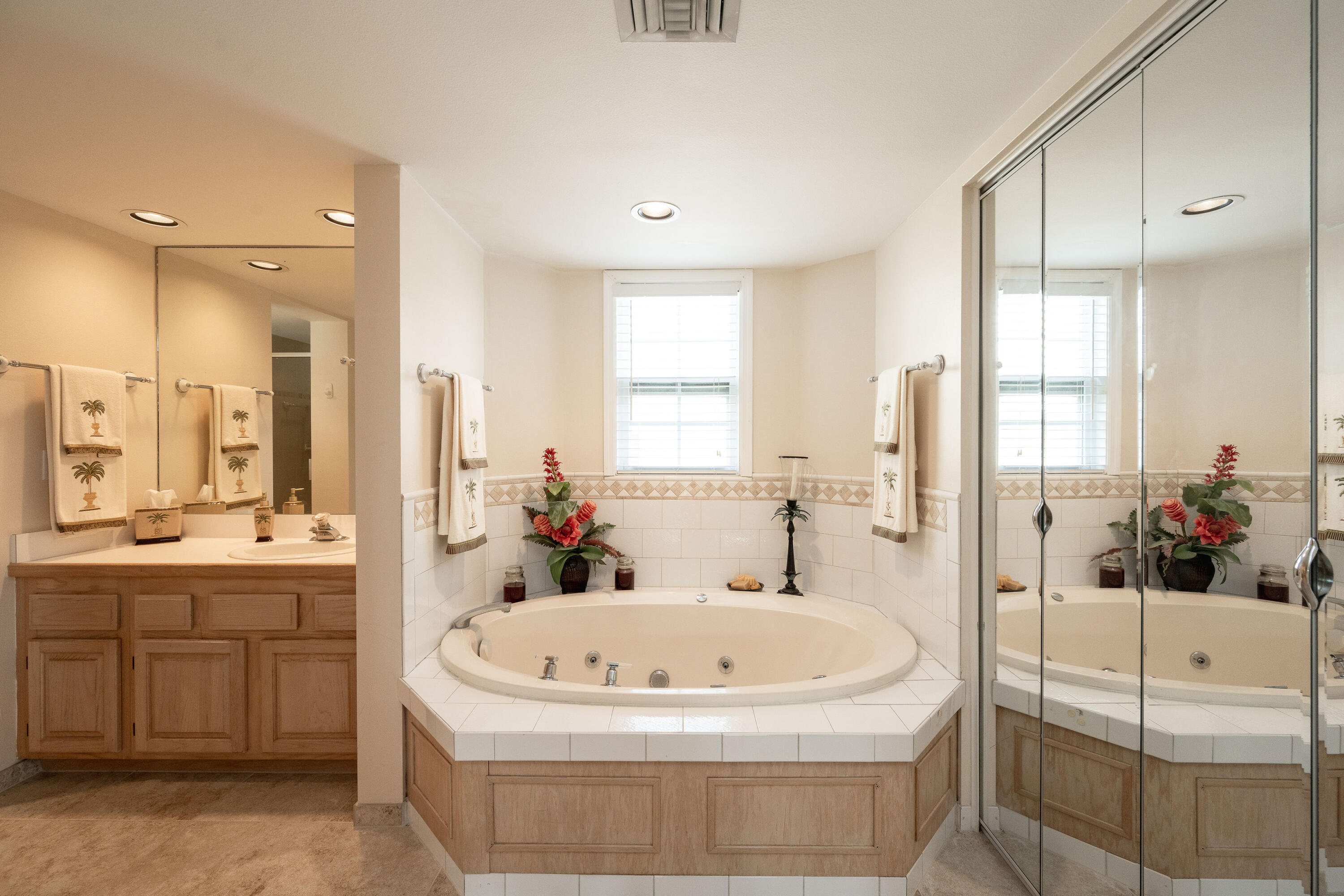 30 Hilton Haven Road, Unit 2A Key West, FL 33040 - Photo 28 of 42 a white bath tub sitting in a bathroom and mirror