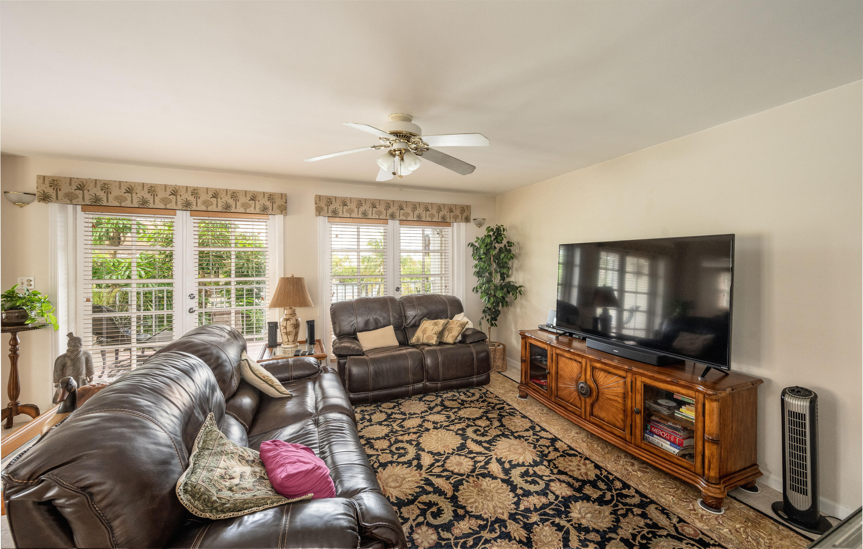 30 Hilton Haven Road, Unit 2A Key West, FL 33040 - Photo 3 of 42 a living room with furniture and a flat screen tv
