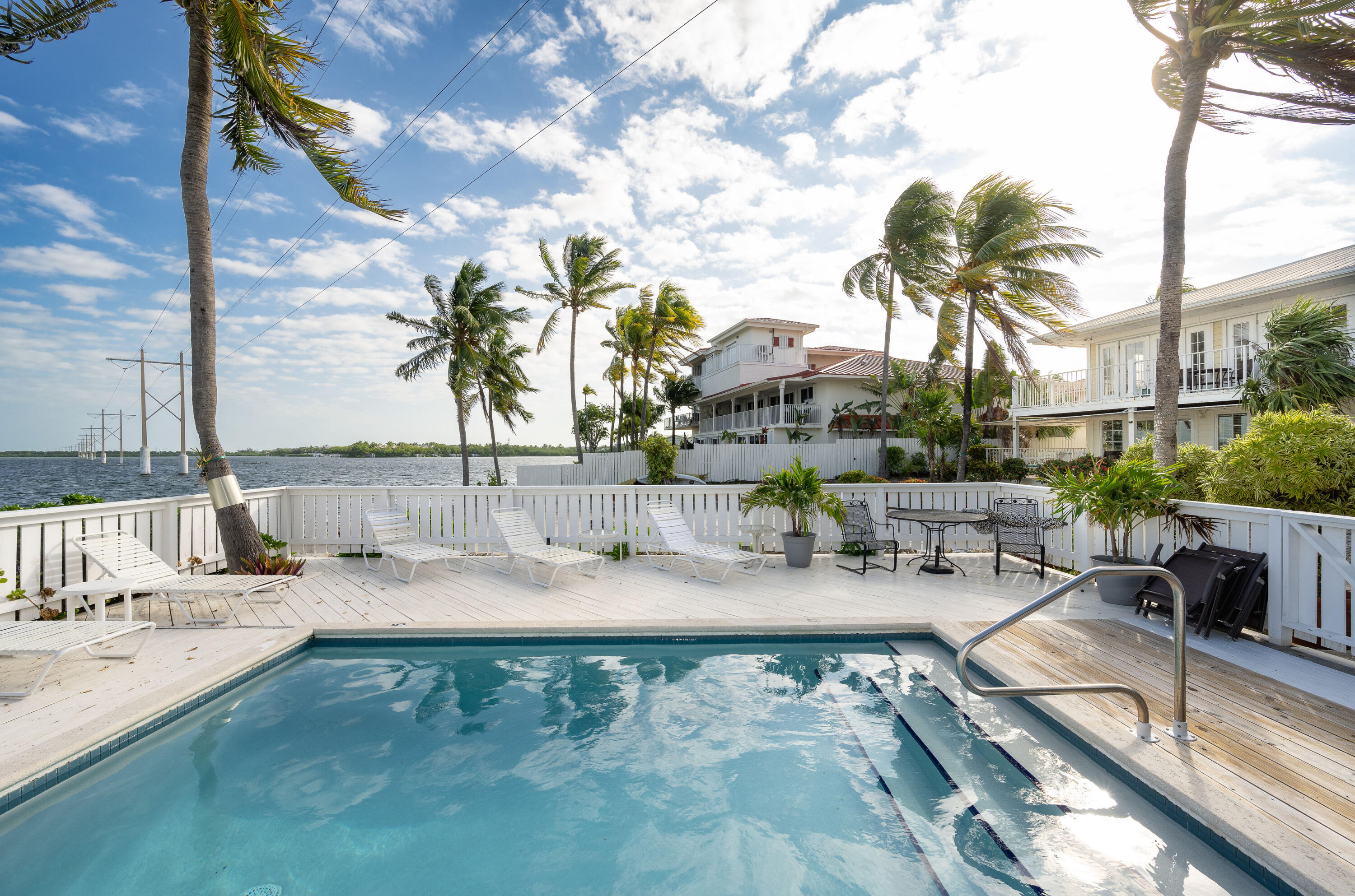 30 Hilton Haven Road, Unit 2A Key West, FL 33040 - Photo 35 of 42 swimming pool with outdoor seating