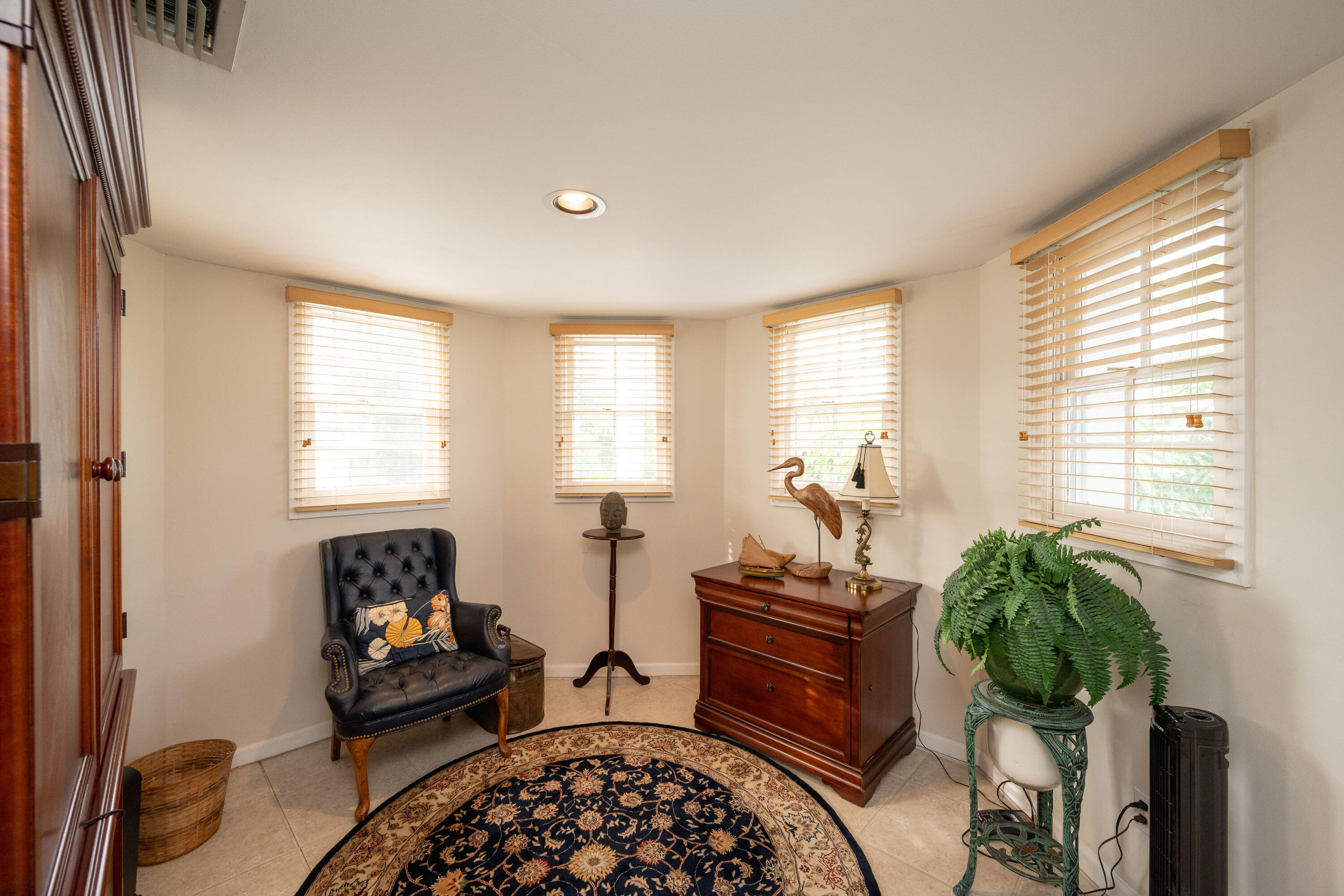 30 Hilton Haven Road, Unit 2A Key West, FL 33040 - Photo 10 of 42 a bedroom with furniture and a potted plant
