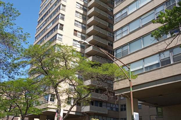 a view of a house with a tree