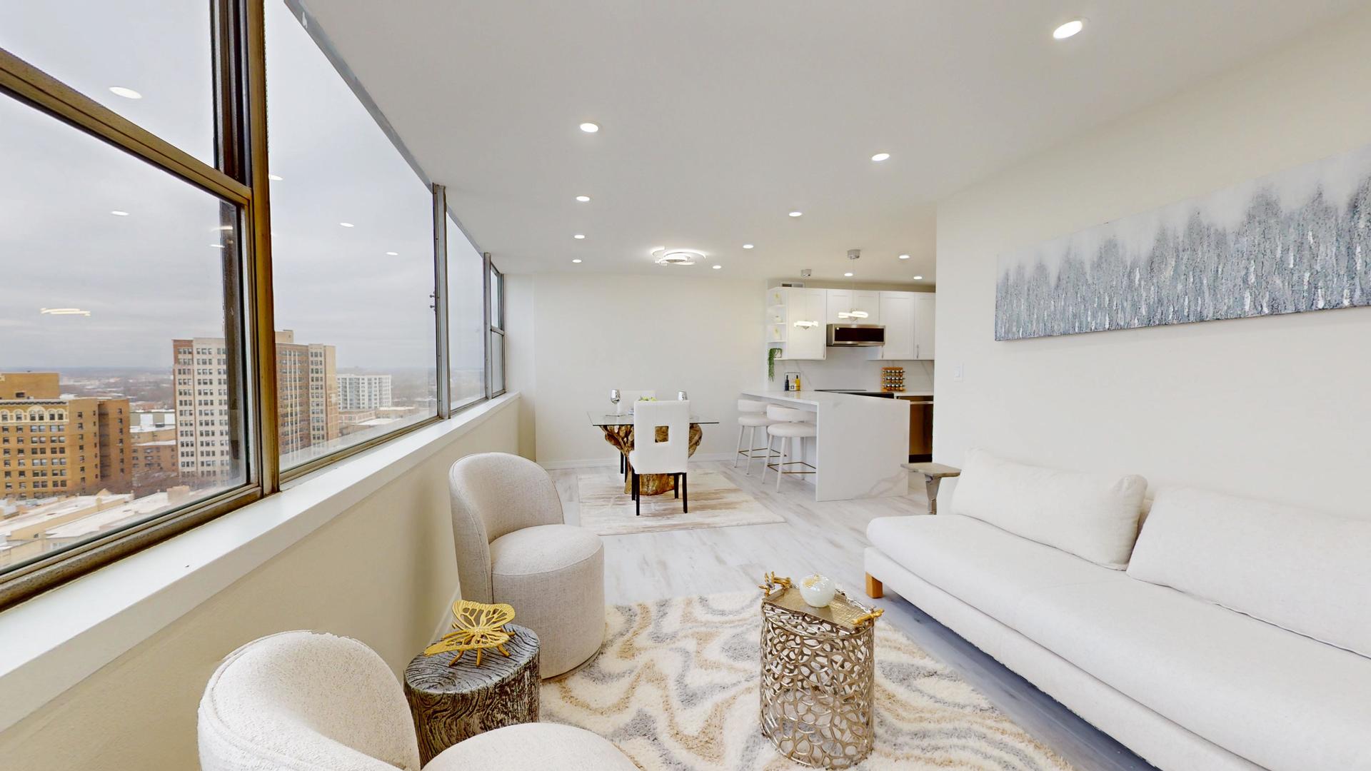 6301 North Sheridan Road, Unit 17G Chicago, IL 60660 - Photo 7 of 14 a living room with furniture and a large window