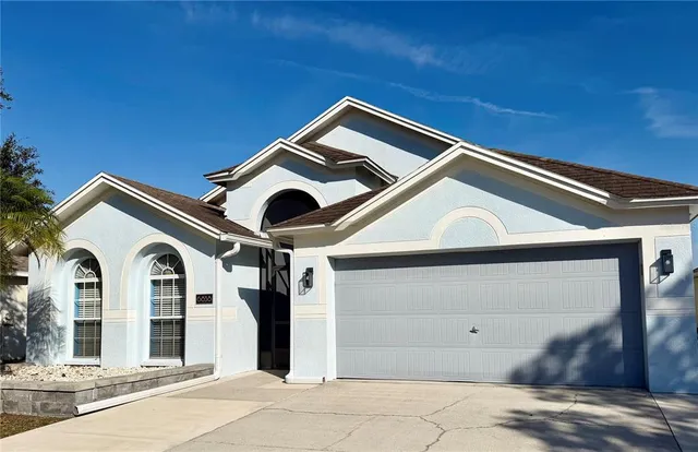 a front view of a house with a garage