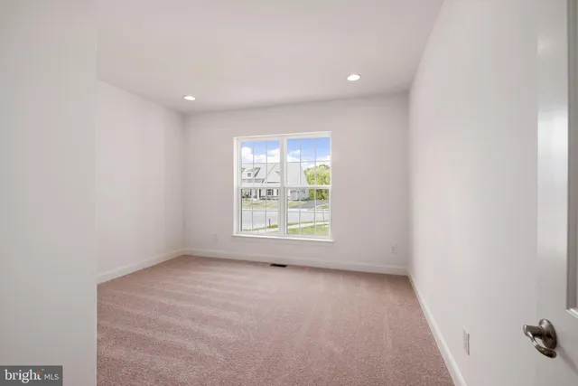 a bathroom with a granite countertop sink a toilet and a mirror