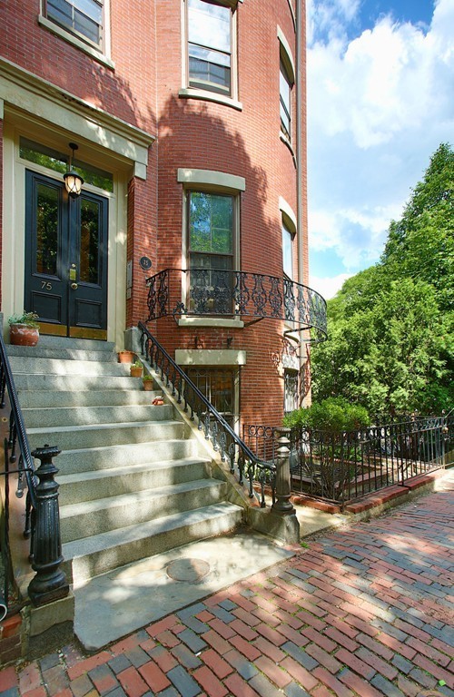 75 Waltham Street, Unit 2 Boston, MA 02118 - Photo 1 of 8 a view of a brick building with many windows