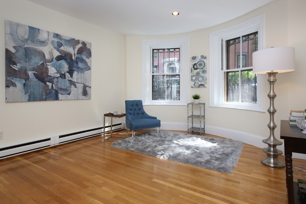 75 Waltham Street, Unit 2 Boston, MA 02118 - Photo 2 of 8 a view of a livingroom with furniture and a window