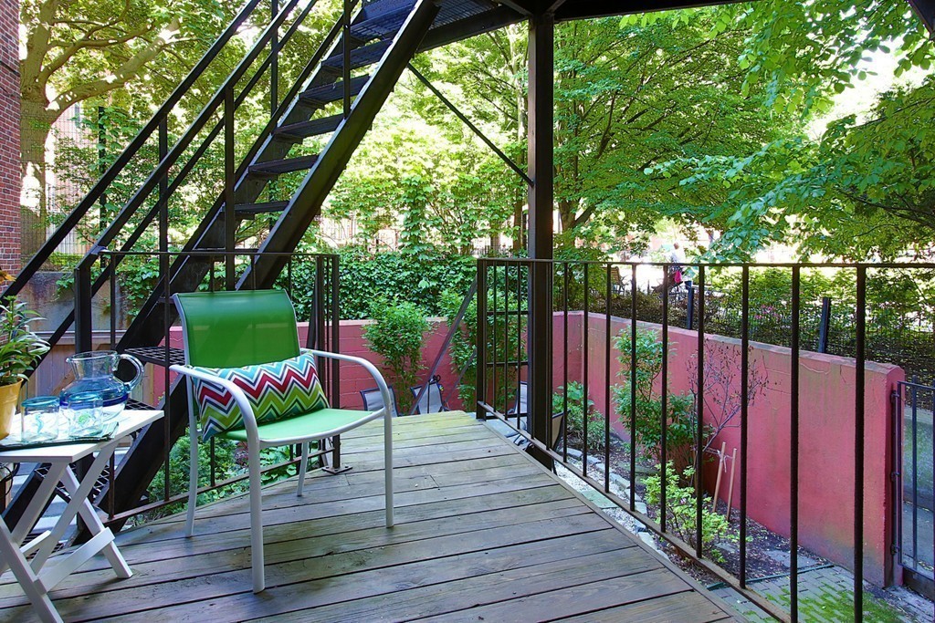 75 Waltham Street, Unit 2 Boston, MA 02118 - Photo 6 of 8 a view of deck with furniture and garden