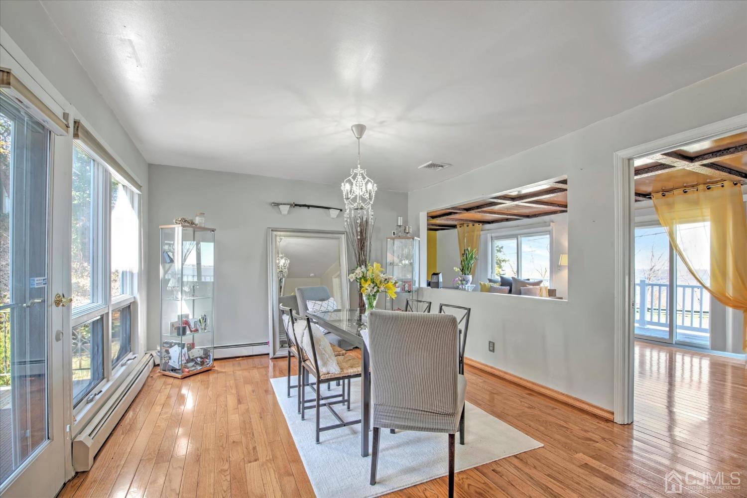 315 Beach Drive Keyport, NJ 07735 - Photo 15 of 40 a view of a dining room with furniture a chandelier and wooden floor