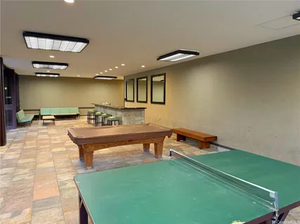 a spacious bathroom with a sink and a mirror