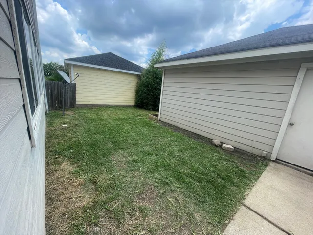 a view of a lake with houses in the back