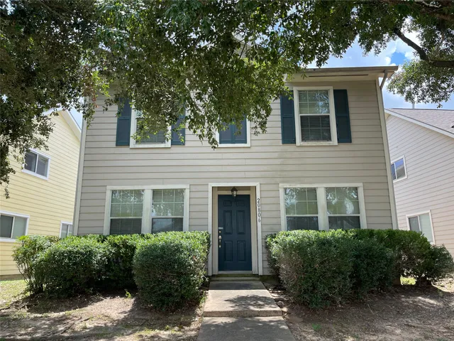 a view of a house with a garden