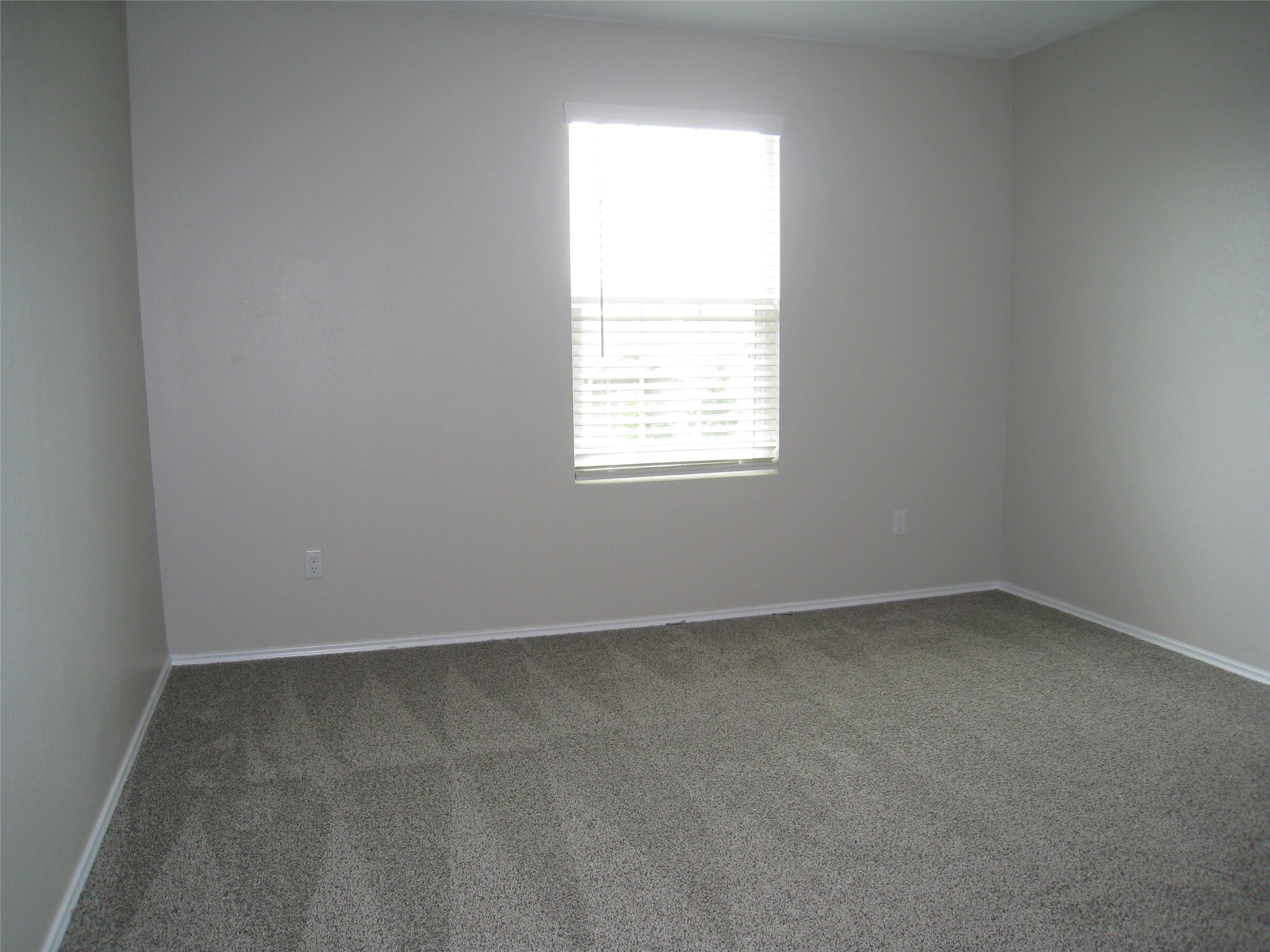 229 Geode Glen Maxwell, TX 78656 - Photo 15 of 19 Well-lit room provides a neutral canvas for personalization and comfort.