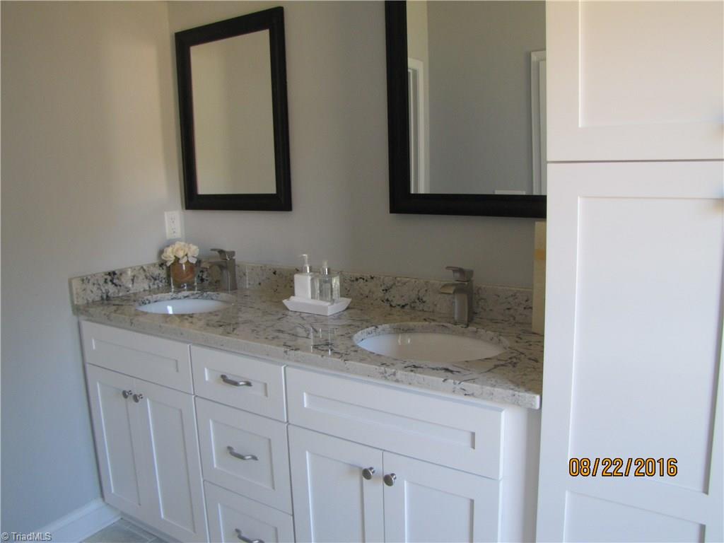 3609 Ruby Road Winston-Salem, NC 27106 - Photo 11 of 27 Master Bathroom has double sink granite top vanity w/linen pantry.