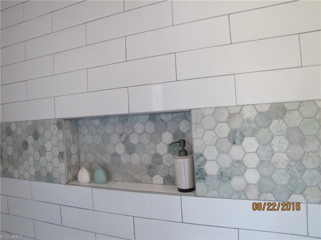 3609 Ruby Road Winston-Salem, NC 27106 - Photo 12 of 27 Master Bathroom: Beautifully detailed tiled rain shower with shelf & bench.