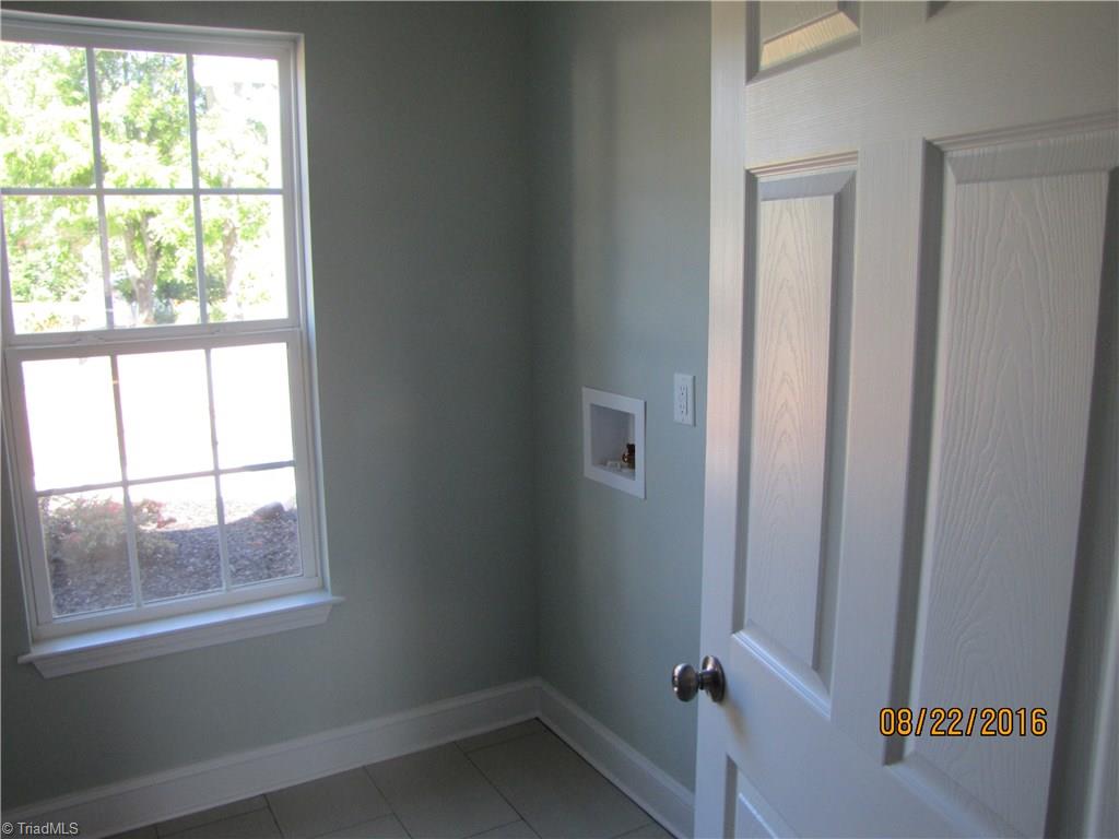 3609 Ruby Road Winston-Salem, NC 27106 - Photo 18 of 27 Walk-in Laundry room off of walk-in Pantry yet separated. Plenty of space for additional storage or folding table.
