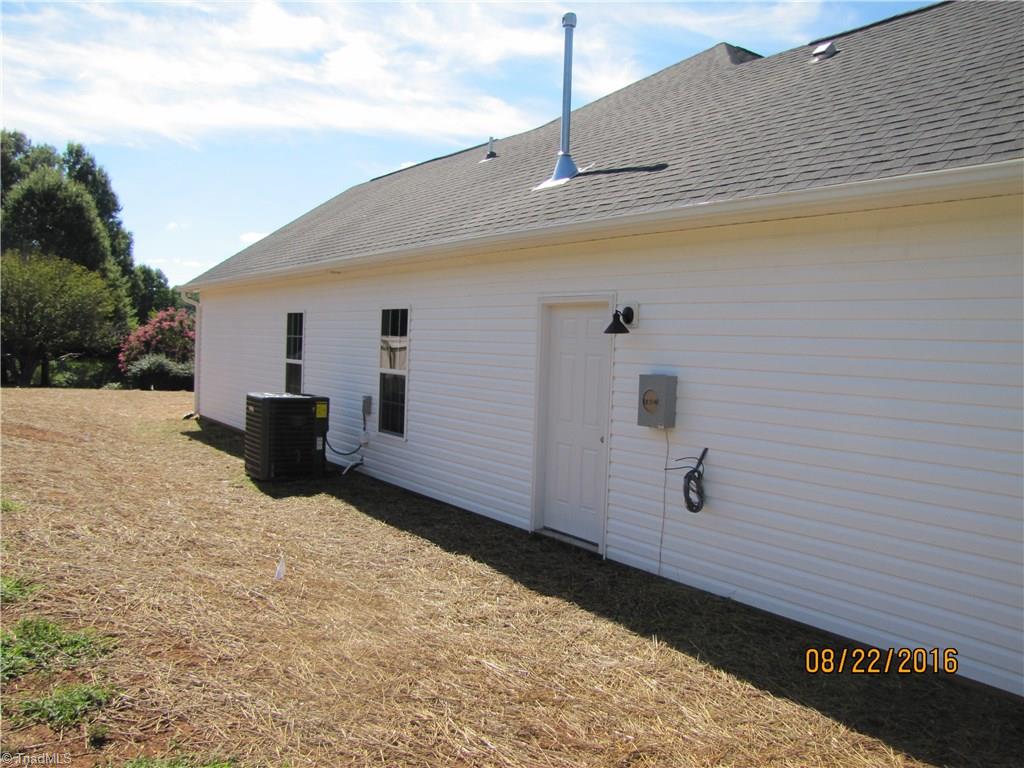3609 Ruby Road Winston-Salem, NC 27106 - Photo 24 of 27 Exterior Side. Door leads out from garage.
