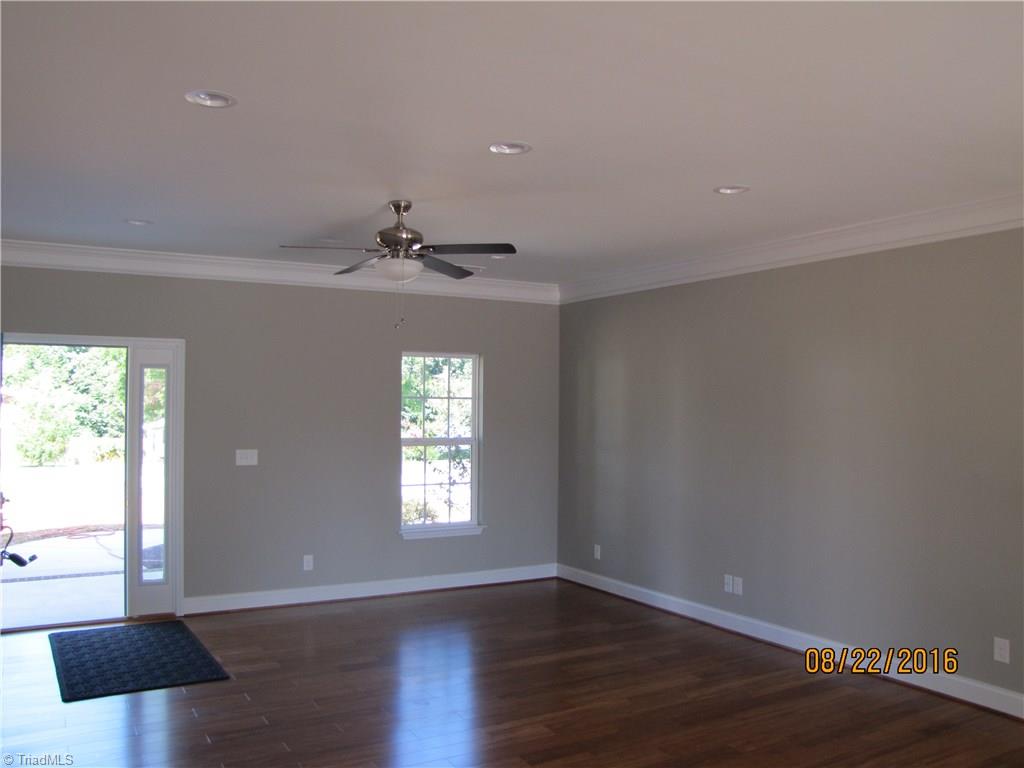 3609 Ruby Road Winston-Salem, NC 27106 - Photo 3 of 27 Looking into the Living room from the Kitchen. Hardwoods in the LR, Kitchen, DR & Halls. Beautiful gray paint colors, 9ft smooth ceilings & crown molding throughout home.