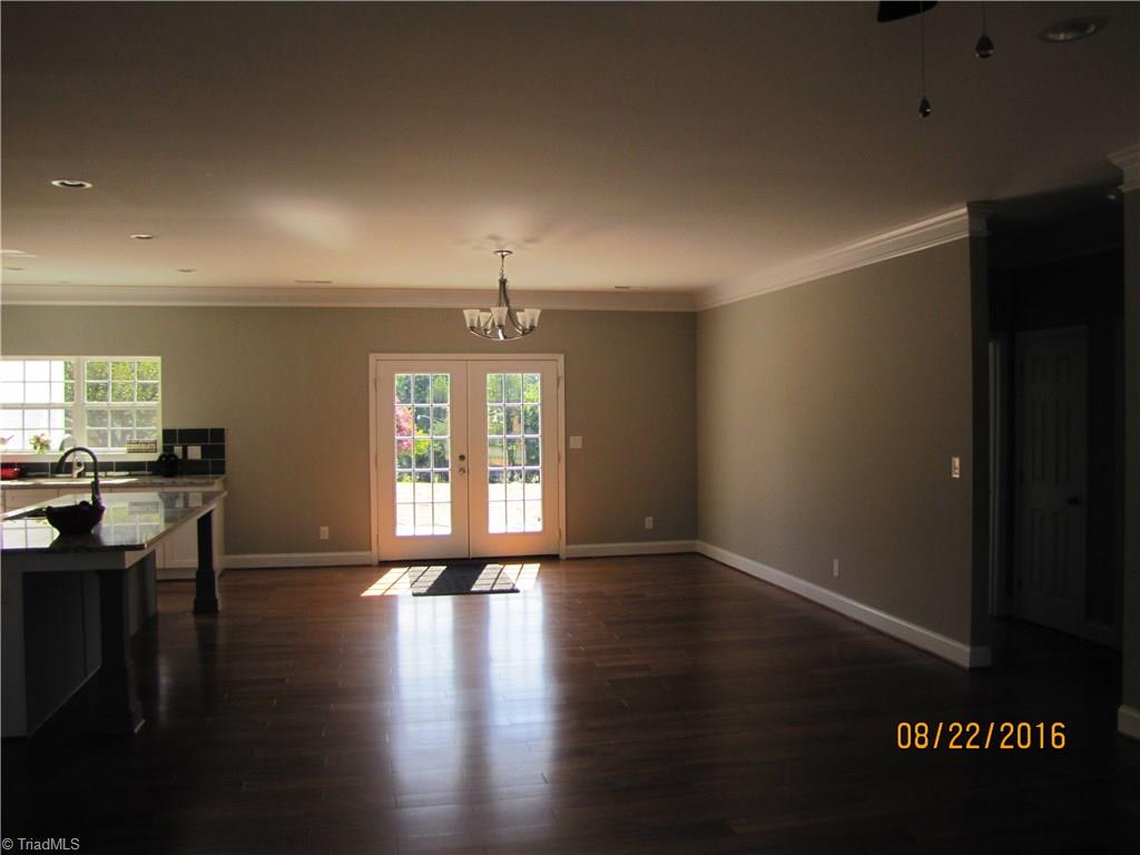 3609 Ruby Road Winston-Salem, NC 27106 - Photo 4 of 27 Looking into the DR from the LR. There is a lot of space in this home. Doors lead out to patio.